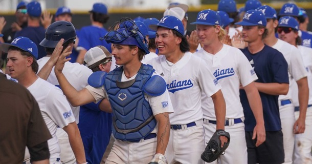 Winning pitcher Parker Wilson (center) celebrates MCC’s Tuesday win over Garden City CC.